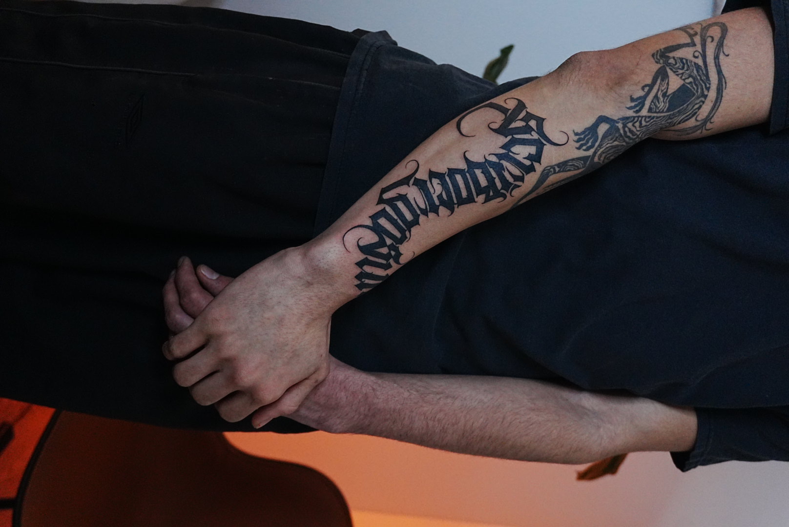 Forearm lettering and lizard sleeve